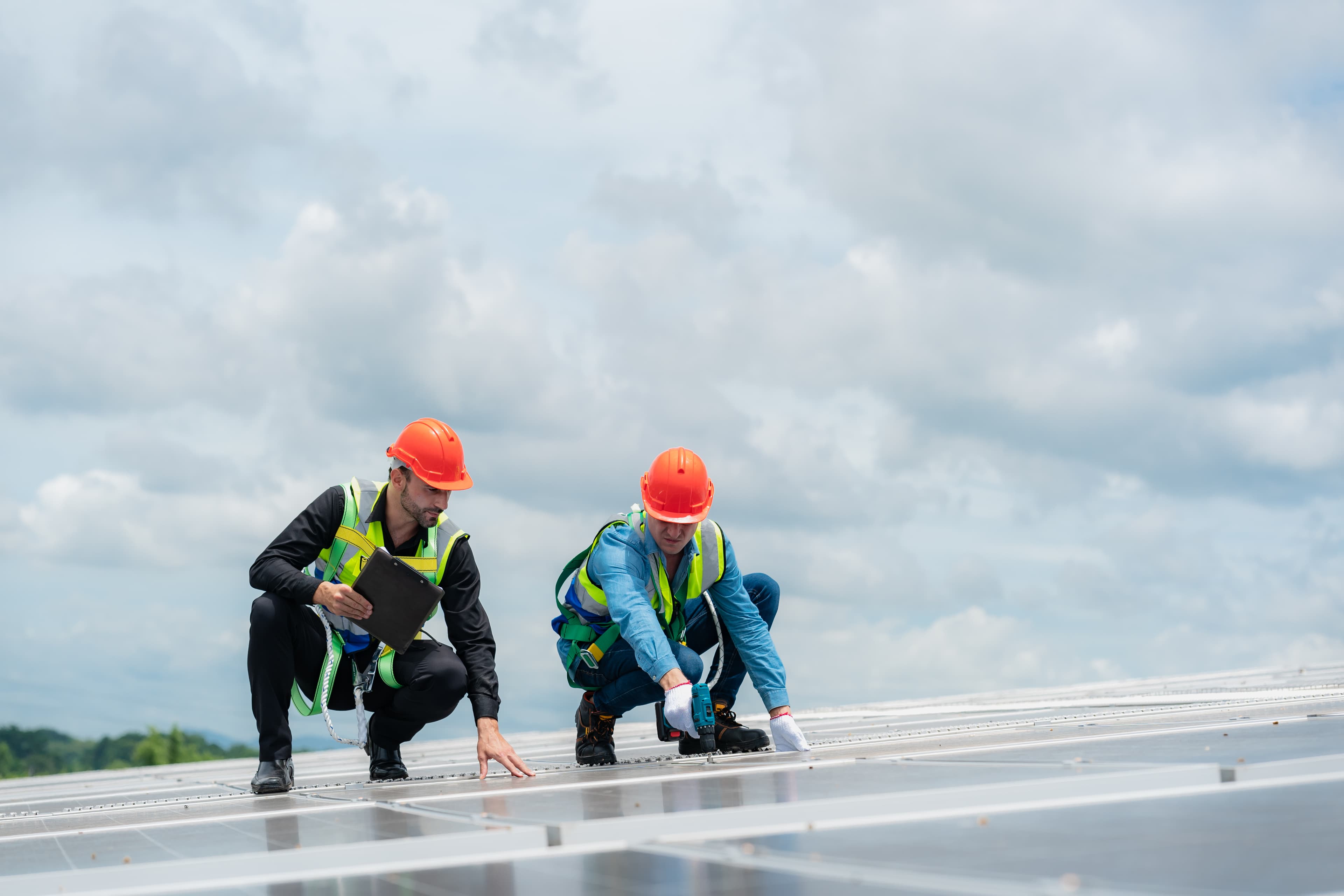 Roof inspector examining roof condition and preparing honest quote for Tampa homeowner